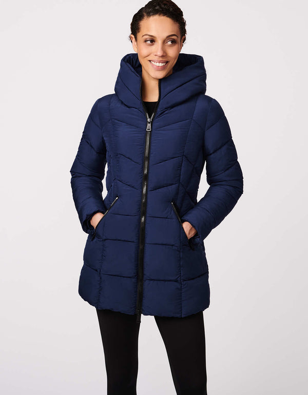 ladies mid length puffer jacket in dark blue with a wide funnel collar and plush hood