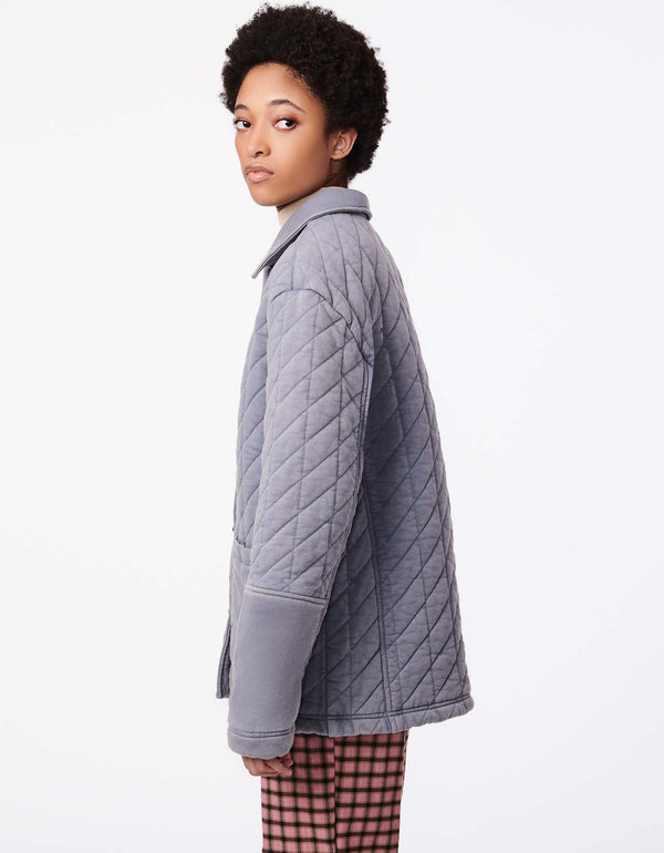 buy winter wear for women: oversized winter jacket in dusty blue color with patch pockets and button up styling