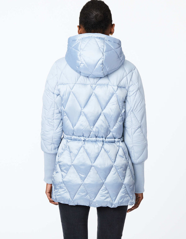 womens eco friendly light blue puffer jacket with sustainable filler and drawstring hood