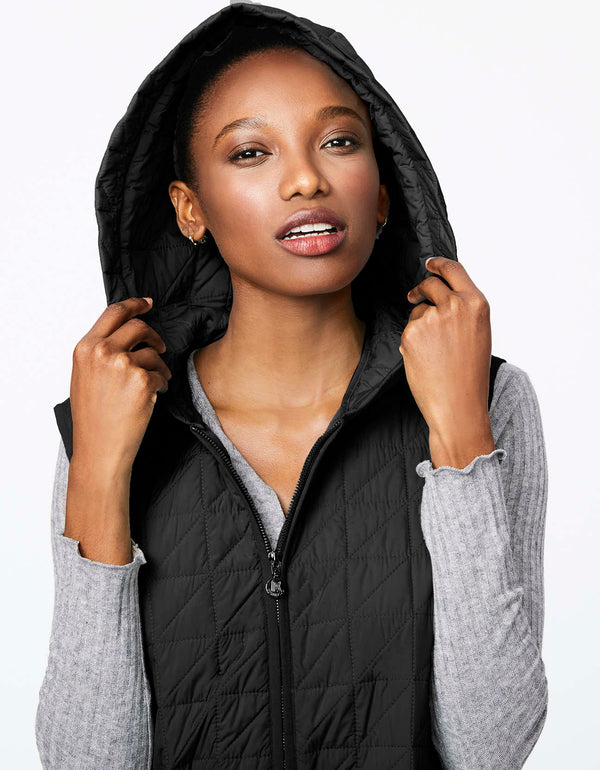 elevate your outerwear game with this long black puffer vest for women