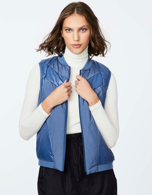blue puffer vest for women with two way zip front and ribbed mock neck for a snug fit