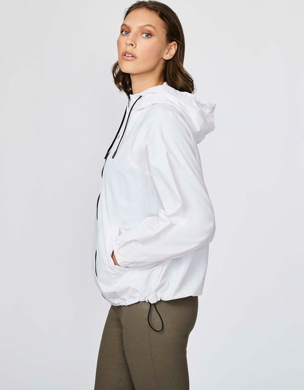 oversize fit white shell jacket with zip hand pockets for convenience