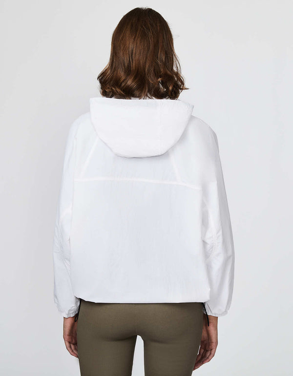 white shell jacket that is roomy and versatile perfect for women on the go