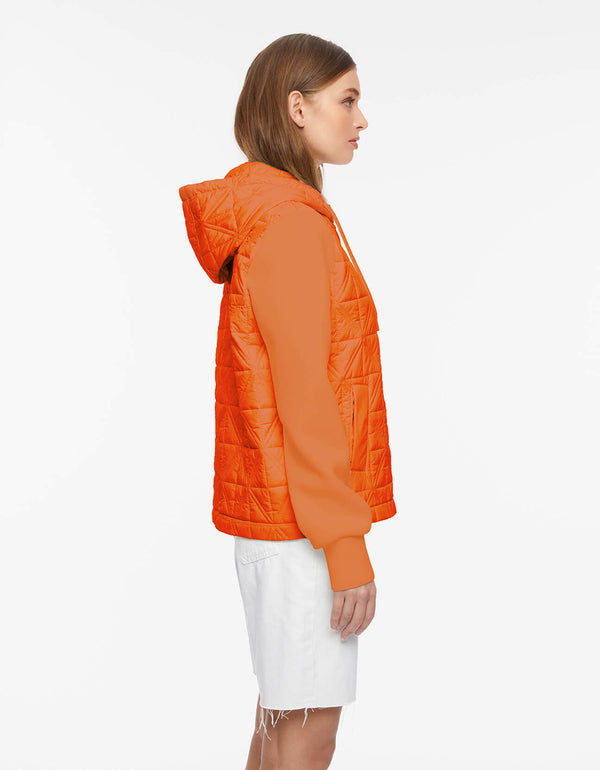 orange puffer jacket designed with modern mix of diamond geometrics and neoprene sleeves