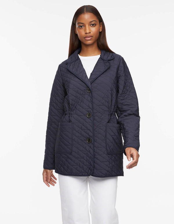 gray colored light quilted jacket with diagonal stitching styled with inner drawstring waist to streamline your look
